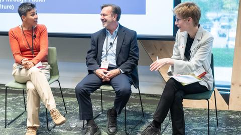 Panelists talking to each other at HILT conference 