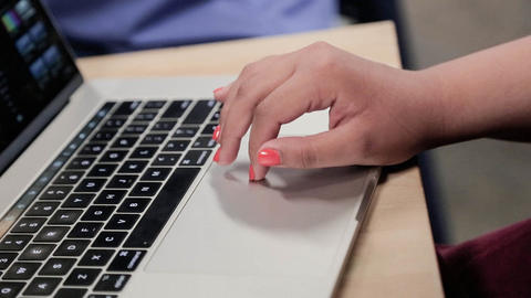 hand using trackpad on macbook