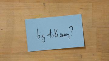 A blue rectangular card with "big takeaway?" written on it in black pen.