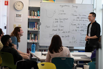 Pedagogy Fellow Longlin Wang teaches a mini-lesson to his peers.