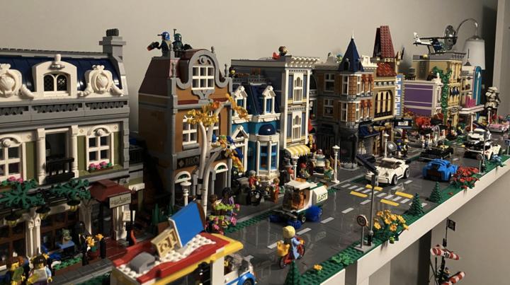 The LEGO city built by Stephan and his partner, featuring several buildings, roads, vehicles, and minifigures.
